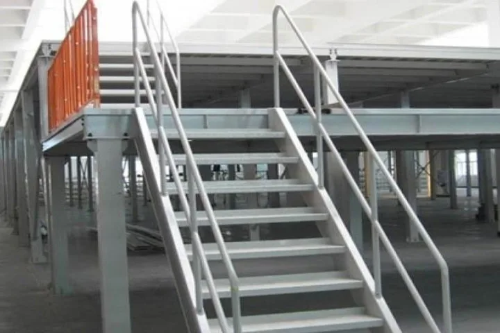 Steel staircase with stainless steel handrails